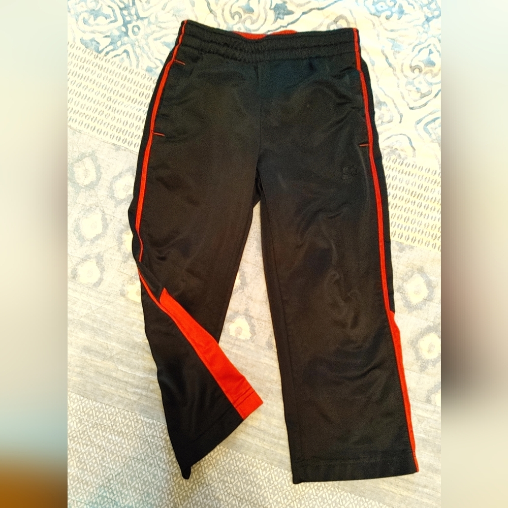 Starter kids black pants with red stripes
